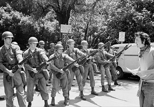 A lone demonstrator stays behind to argue with the National Guards troops who moved in to help California Highway patrolmen break up an unauthorized rally on the University of California Campus in Berkeley, Ca., Friday, May 16, 1969.  The guard was called by Gov. Ronald Reagan Thursday after a bloody riot over the fencing of People's Park, which had been built on school property.  Several persons were shot when police opened fire with shotguns filled with birdshot.  (AP Photo)
