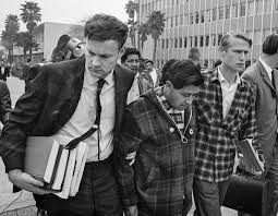 Jerry Cohen (left) and LeRoy Chatfield (right) lead Cesar Chavez into court during his fast in 1968.  R.O. Oliver. Los Angeles Times Archive